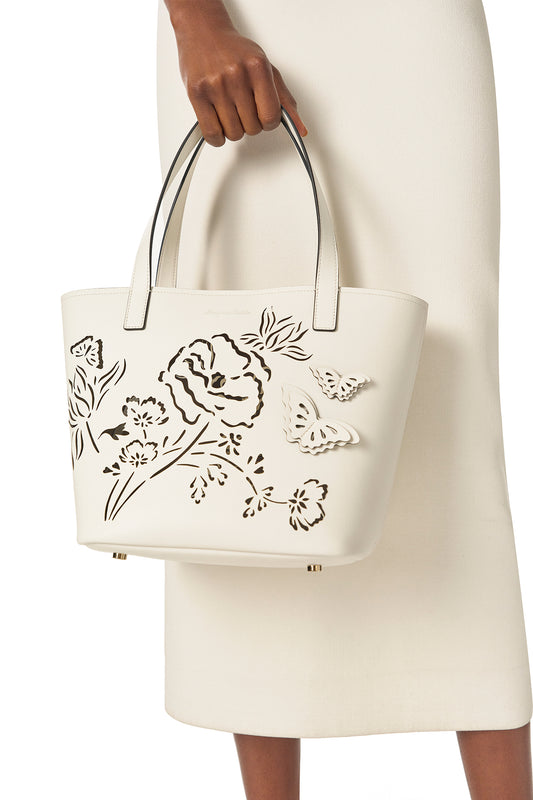 Leather top handle tote bag with laser cut florals, three-dimensional leather butterflies and small zip pouch in Ivory- modeled