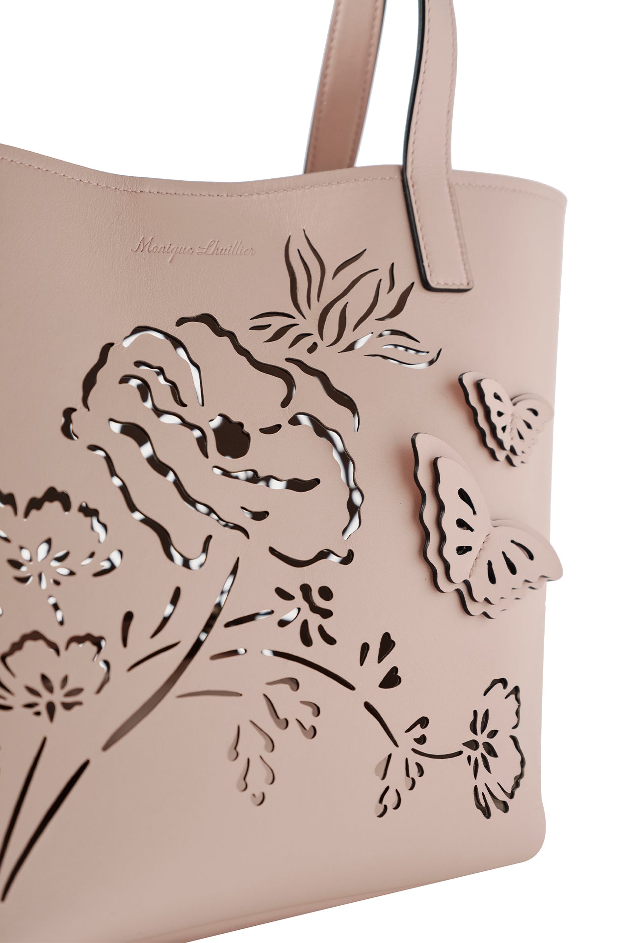 Leather top handle mini tote bag with laser cut florals, three-dimensional leather butterflies and small zip pouch in Blush- front detail