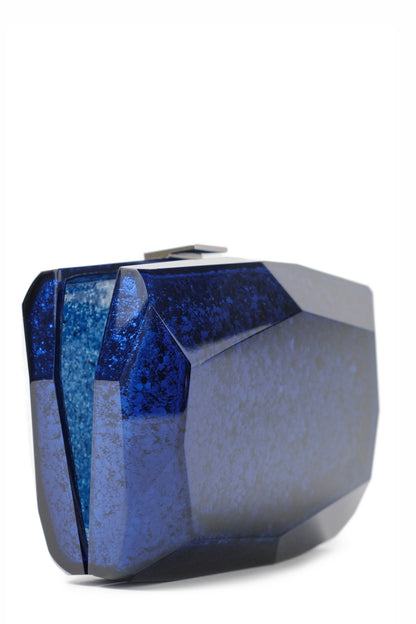 Lucite faceted minaudière with silver metal clasp at top in Blue- open