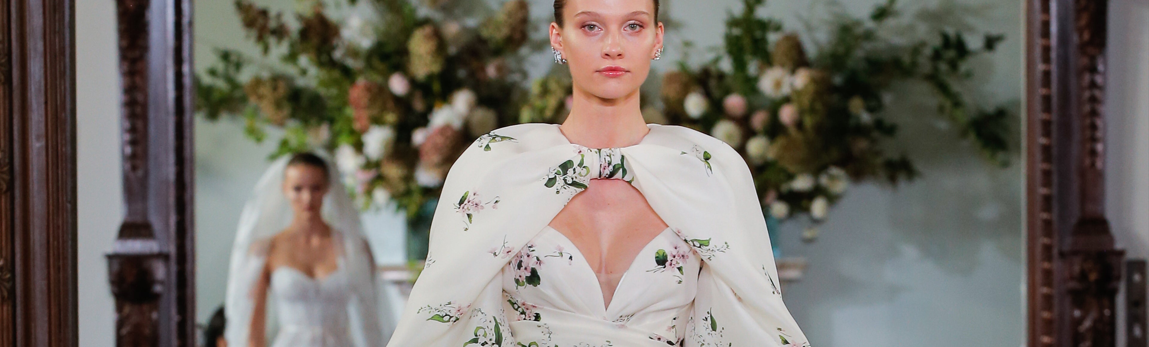 Monique Lhuillier Fall 2026 Bridal Ivory/Multi Pique Gazar strapless draped Beatrix ballgown with billow sleeve Beatrix jacket - runway. 