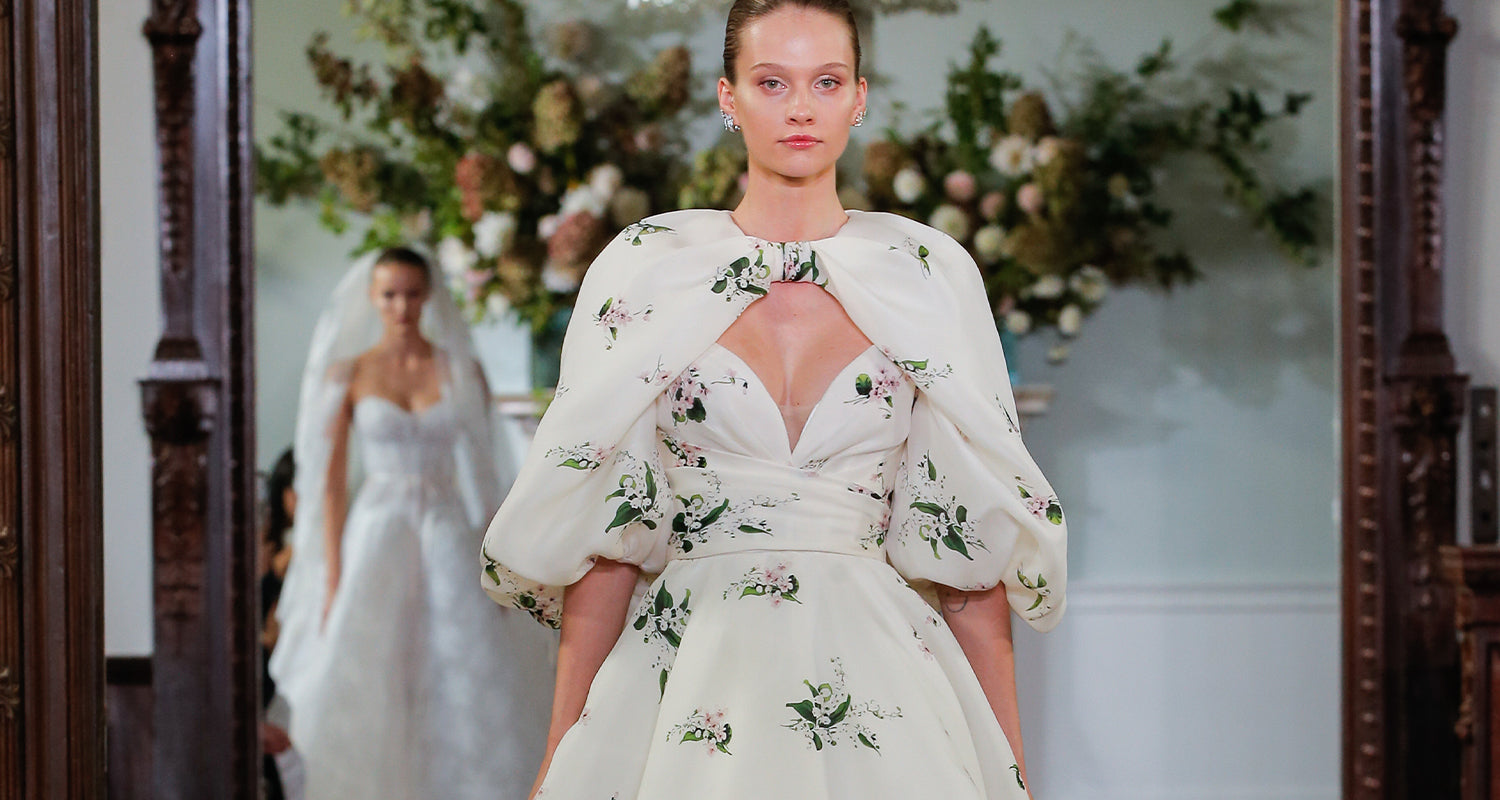 Monique Lhuillier Fall 2026 Bridal Ivory/Multi Pique Gazar strapless draped Beatrix ballgown with billow sleeve Beatrix jacket - runway. 