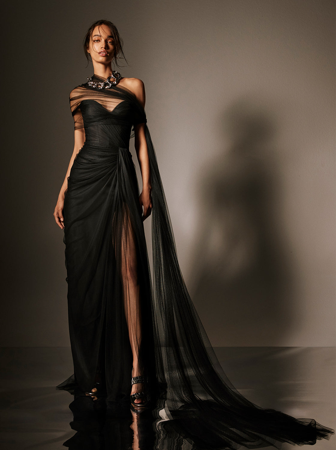 Monique Lhuillier Spring 2026 Strapless draped gown with detachable wrap
and streamers in Noir Spanish tulle - lookbook.
