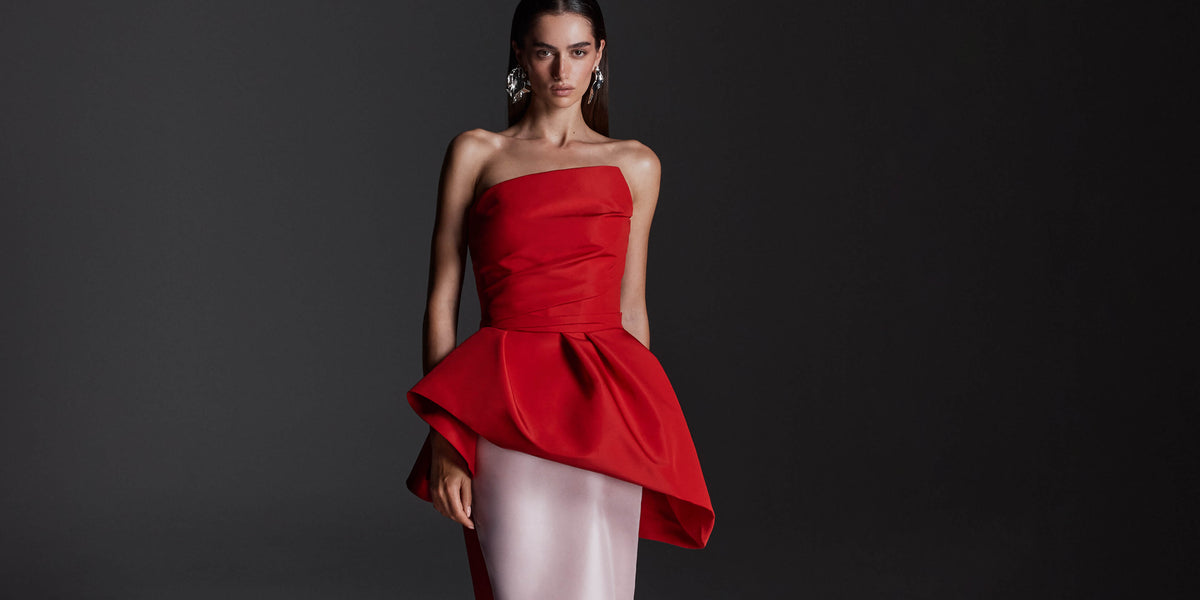 Monique Lhuillier Fall 2026 vibrant red and pale pink Silk Faille & Mikado strapless peplum bodice with column skirt and train -lookbook.