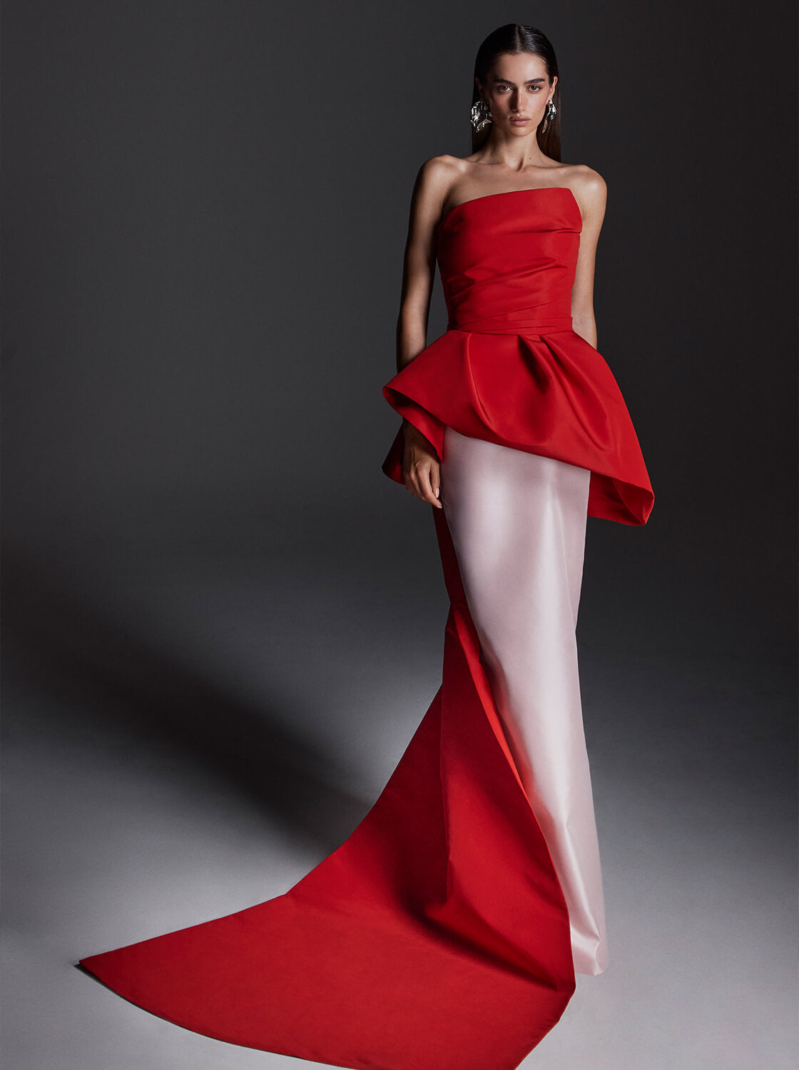 Monique Lhuillier Fall 2026 vibrant red and pale pink Silk Faille & Mikado strapless peplum bodice with column skirt and train -lookbook.