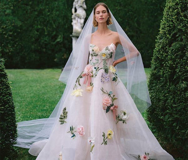 Monique Lhuillier Fall 2025 cameo and multicolored floral Amalfi ballgown with 3D applique and tulle veil on model outside 