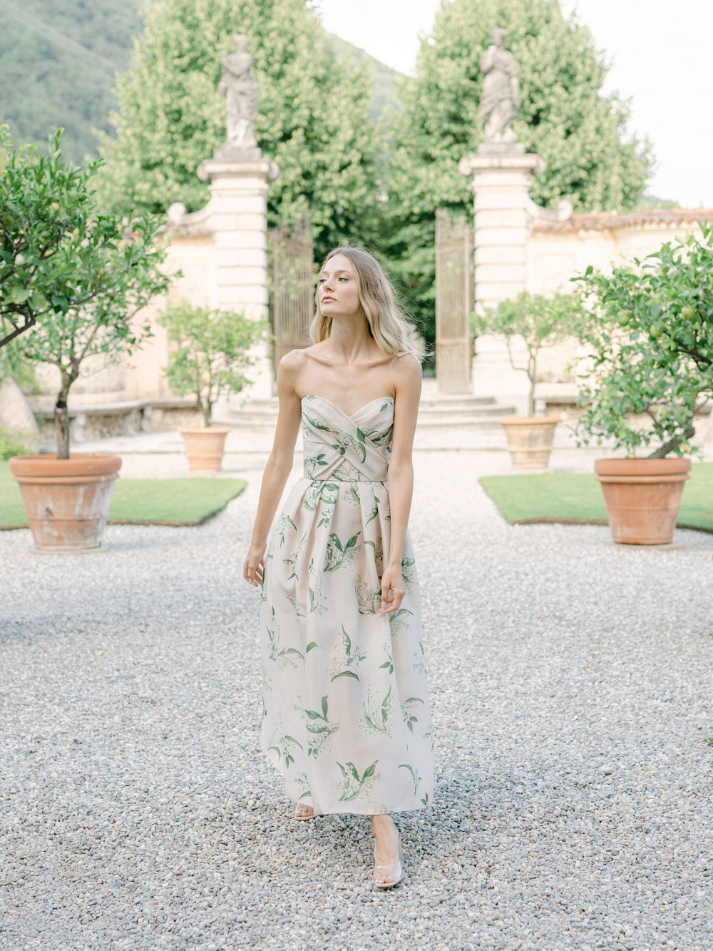 Monique Lhuillier strapless, midi length "Florette" dress in blush & leaf printed organza - lookbook photo on model.