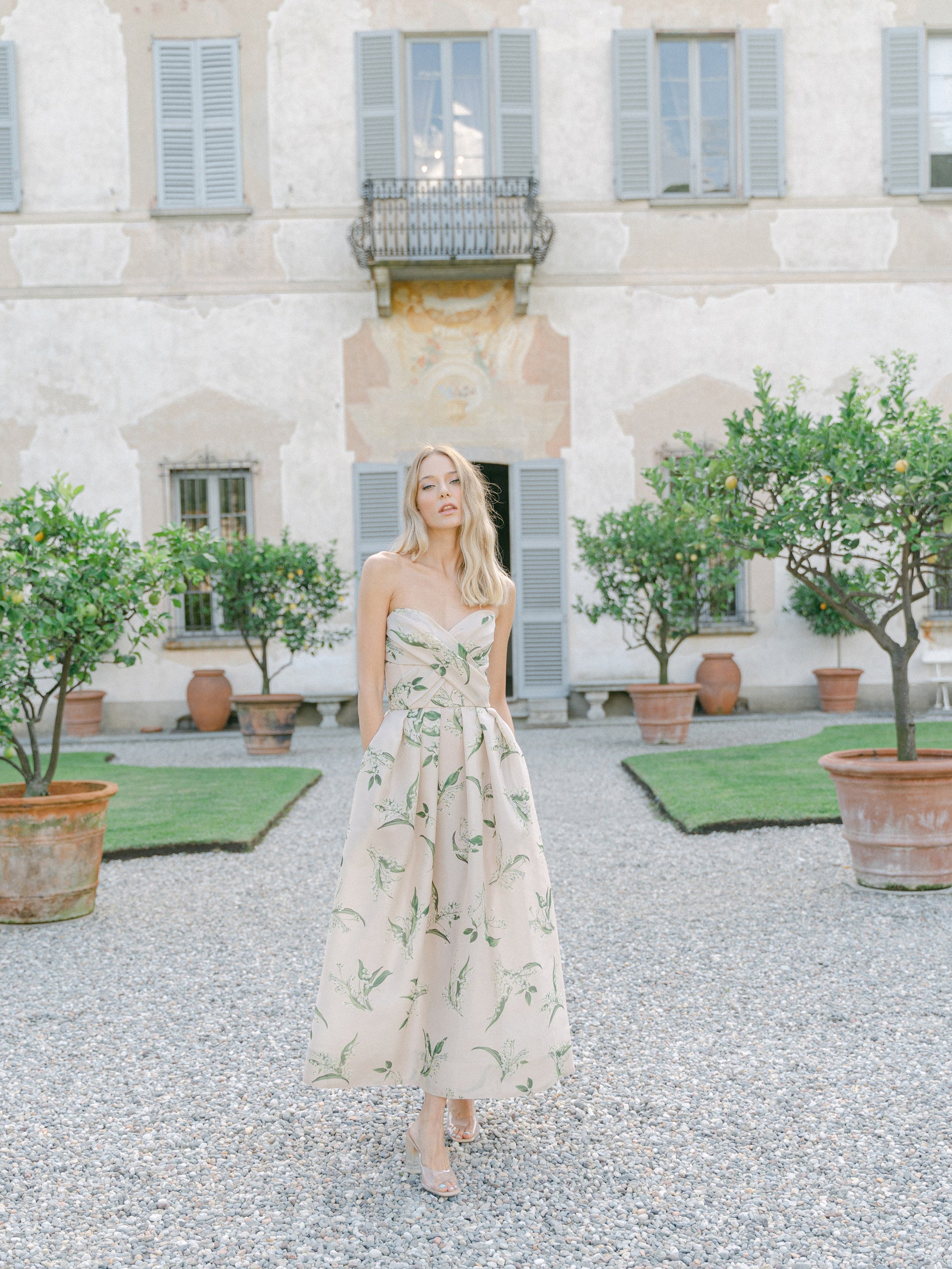 Monique Lhuillier strapless, midi length "Florette" dress in blush & leaf printed organza - lookbook photo on model.