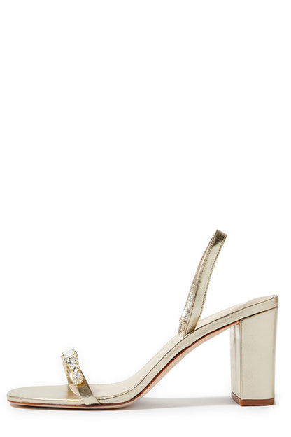 Monique Lhuillier Hollis heel in gold leather with rhinestone toe strap and block heel.