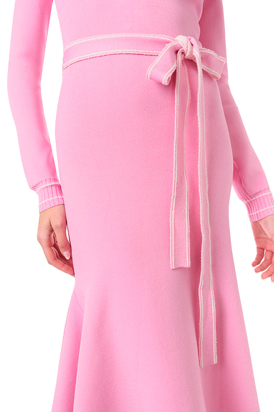 Monique Lhuillier Fall 2024 pink knit long sleeve dress with handkerchief hem and self-tie belt - detail.