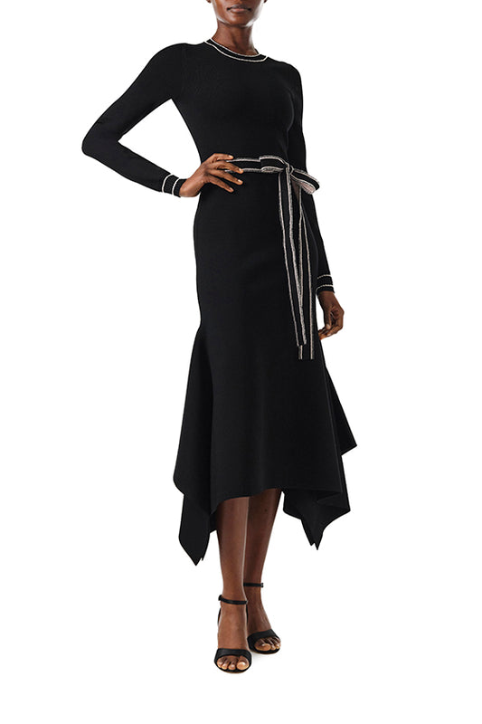 Monique Lhuillier Fall 2024 black knit long sleeve dress with handkerchief hem and self-tie belt - front.