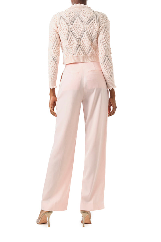 Monique Lhuillier Fall 2024 long sleeve, cropped bobble cardigan in Pale Blush wool cable knit - back.