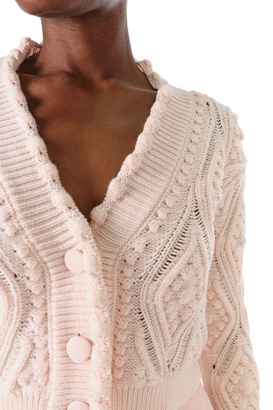 Monique Lhuillier Fall 2024 long sleeve, cropped bobble cardigan in Pale Blush wool cable knit - fabric detail.