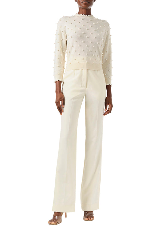 Monique Lhuillier Fall 2024 creme cashmere long sleeve sweater with pearl embroidery and trim - front full.