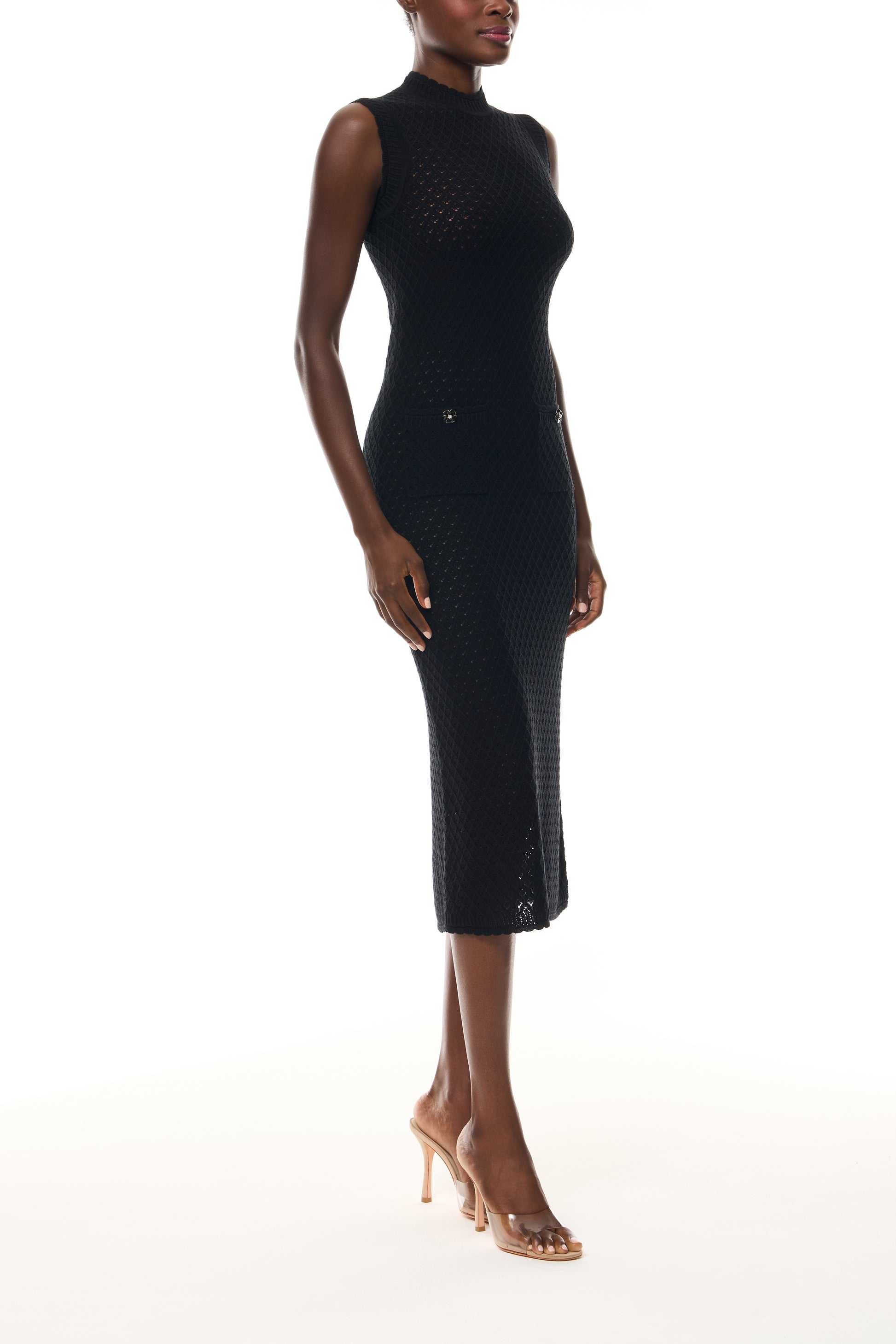 Monique Lhuillier Fall 2025 RTW Noir Sleeveless Shift Dress in  Cotton Diamond Lace knit with two front pockets - side.