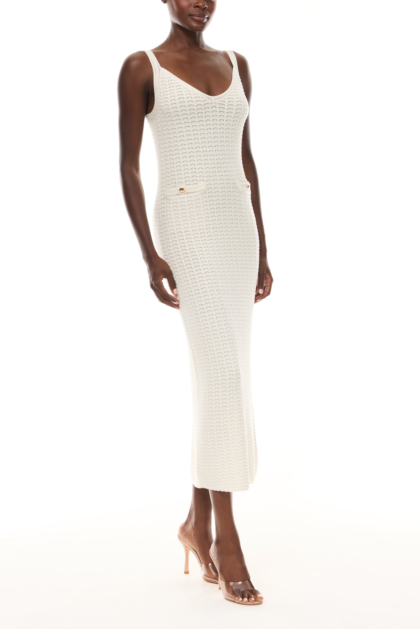Monique Lhuillier Spring 2026 Ivory Cotton Viscose Knit Lace stitch sleeveless dress with gold buttons - side.