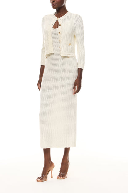 Monique Lhuillier Spring 2026 Ivory Cotton Viscose Knit Lace stitch cardigan with gold buttons with coordinating dress  - side.