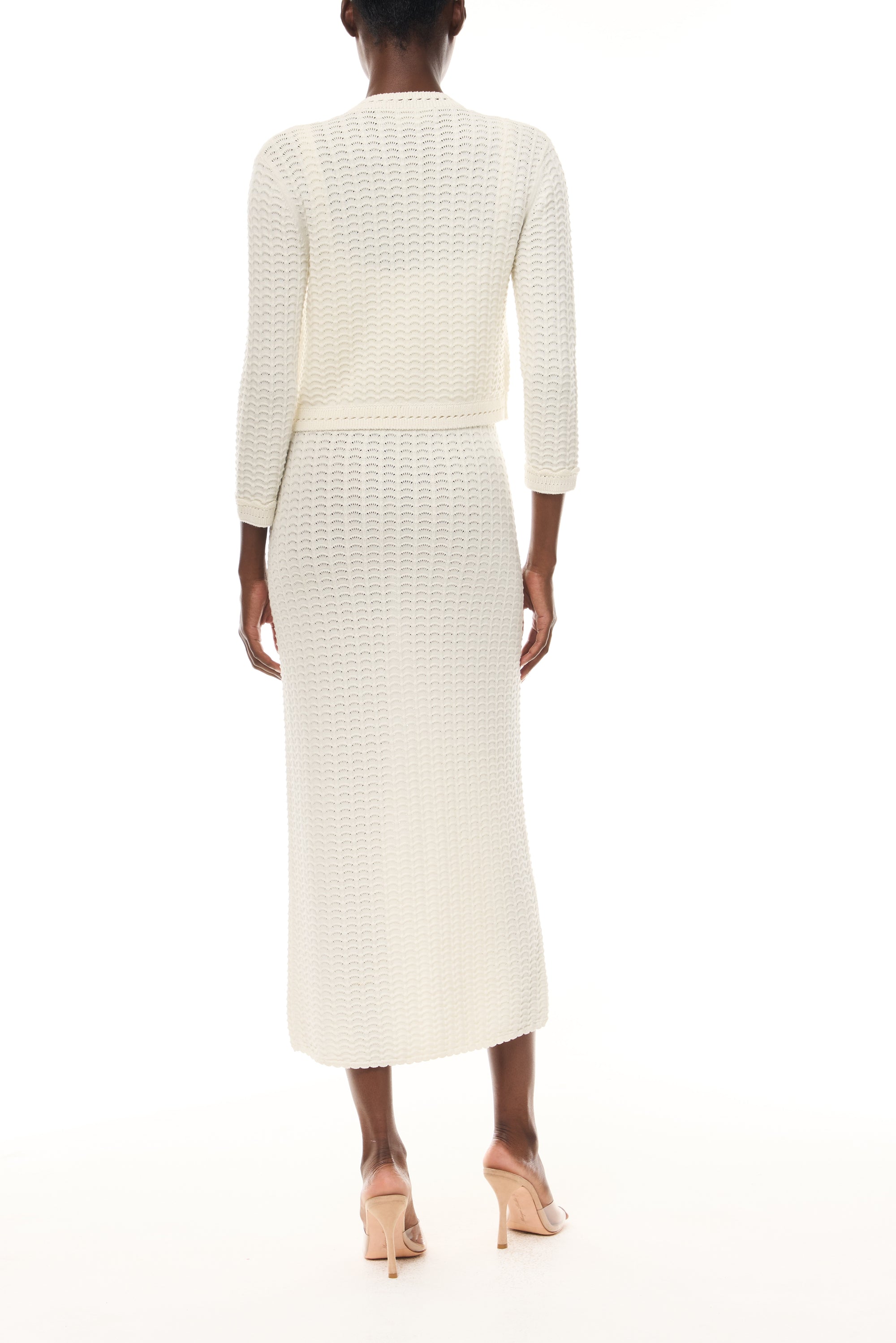 Monique Lhuillier Spring 2026 Ivory Cotton Viscose Knit Lace stitch cardigan with gold buttons with coordinating dress  - back.