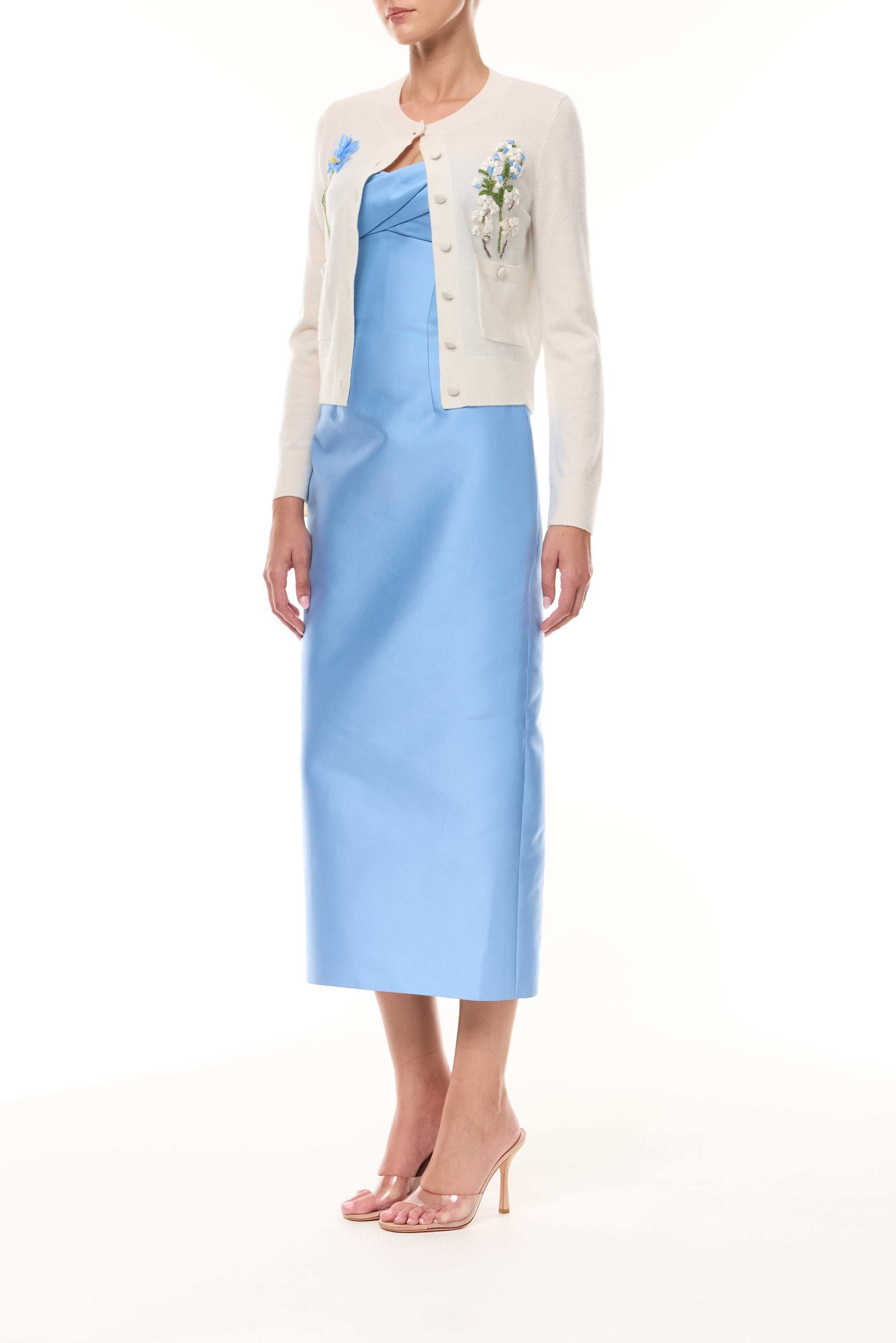 Monique Lhuillier Spring 2026  Ivory Cashmere long sleeve Cardigan with floral embroidery and pockets - side.