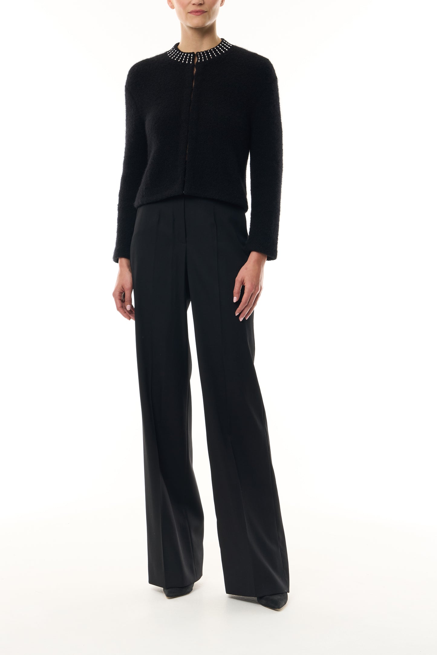 Monique Lhuillier Fall 2026 Noir bouclé knit jacket with crystal trim neckline and hook and eye closures - front. 