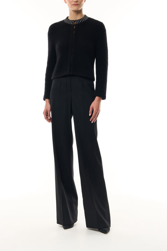 Monique Lhuillier Fall 2026 Noir bouclé knit jacket with crystal trim neckline and hook and eye closures - front. 