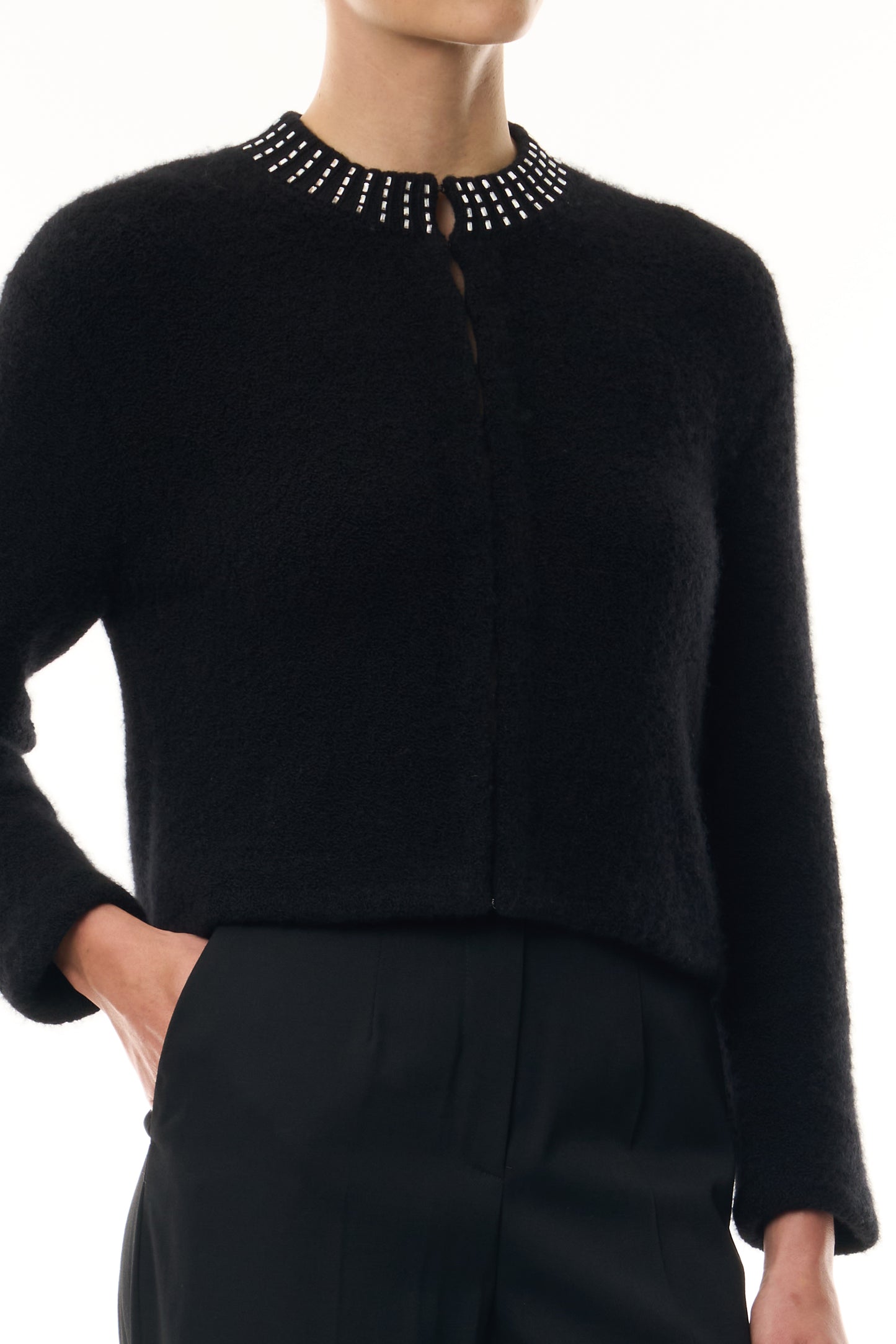 Monique Lhuillier Fall 2026 Noir bouclé knit jacket with crystal trim neckline and hook and eye closures - fabric.