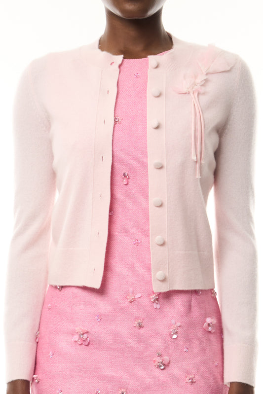 Monique Lhuillier Fall 2026 pale pink cashmere cardigan with floral applique - fabric. 