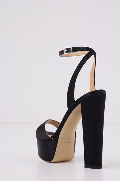 Khloe platform heel in black satin fabric with silver buckle ankle strap - angle back.