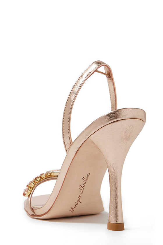 Monique Lhuillier Kirby heel in rose gold metallic leather with rhinestone toe strap and slingback.