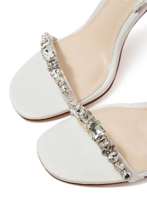 Monique Lhuillier Kirby heel in silk white satin with rhinestone toe strap and slingback.