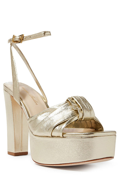 Monique Lhuillier gold leather Kris platform heel with knotted toe strap and gold hardware.