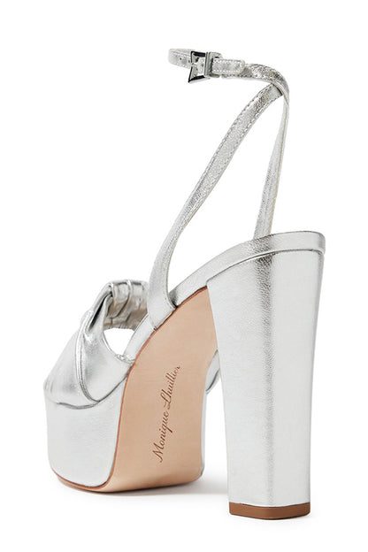 Monique Lhuillier silver leather Kris platform heel with knotted toe strap and silver hardware.