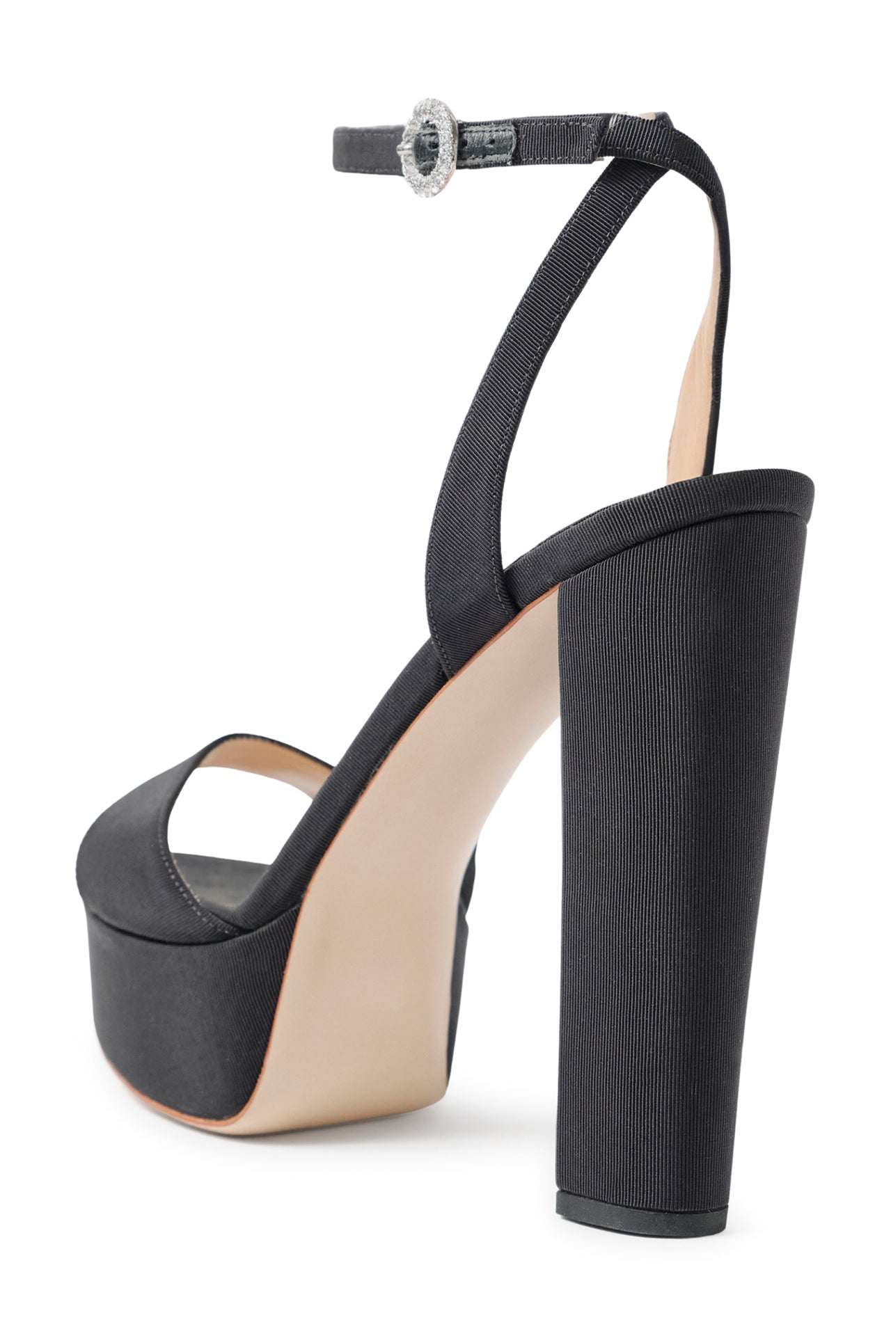 Khloe platform heel in black faille fabric with crystal buckle ankle strap - angle back.