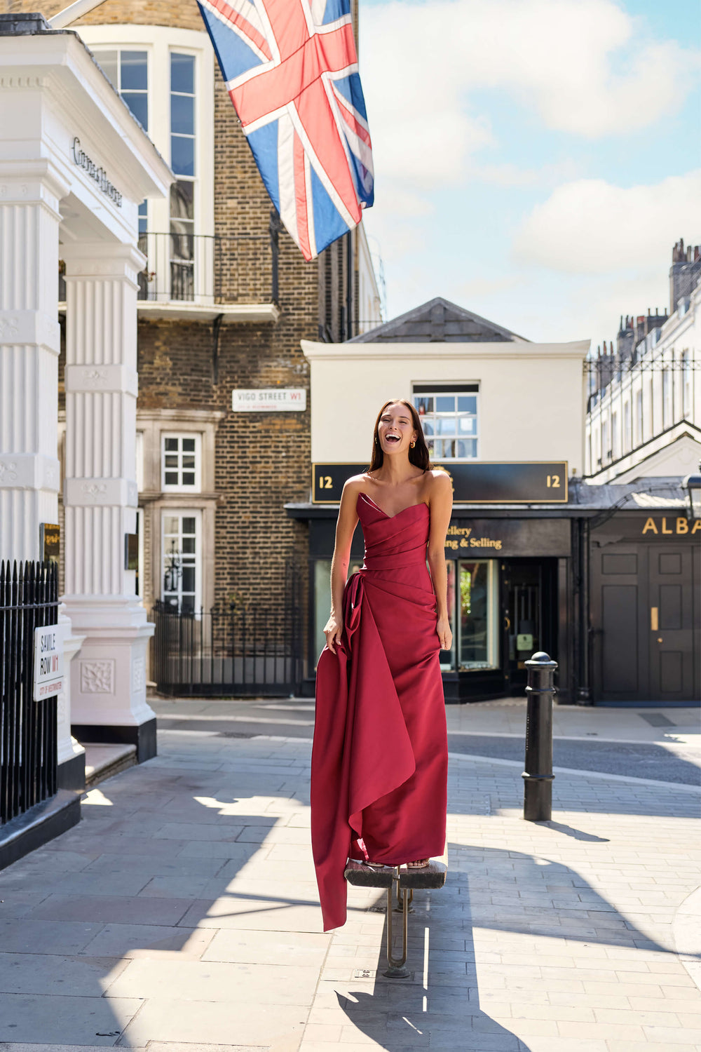 Monique Lhuillier Fall 2026 Rhubarb Silk Faille asymmetric strapless draped gown with train - lookbook.