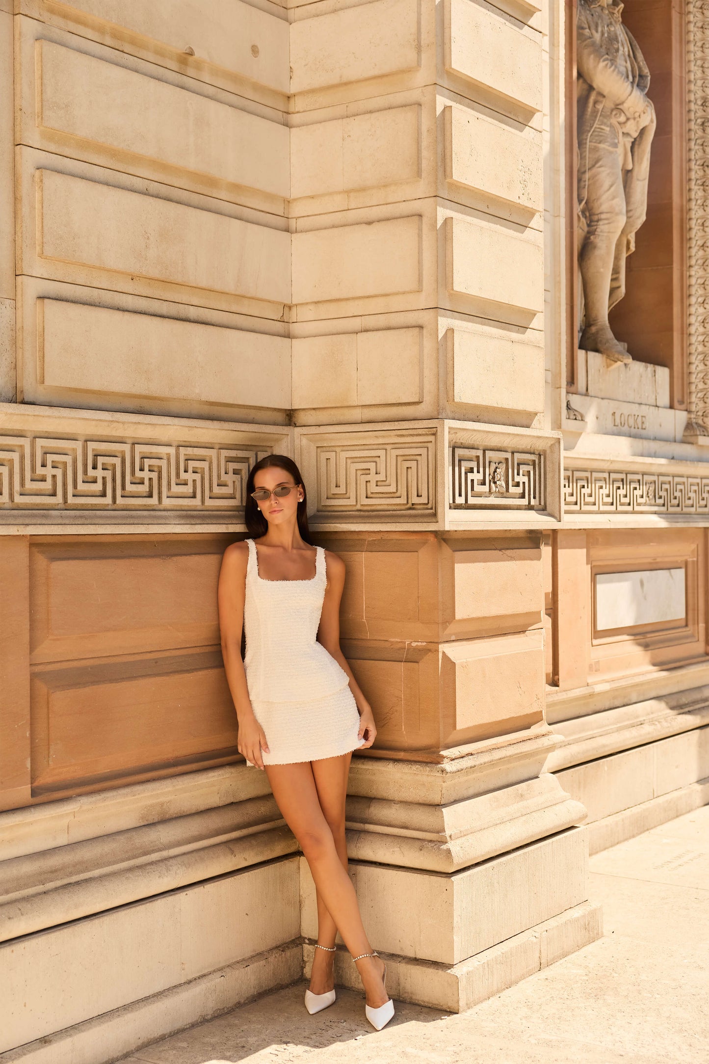 Monique Lhuillier Fall 2026 Silk White Clip Jacquard sleeveless peplum mini dress - lookbook. 