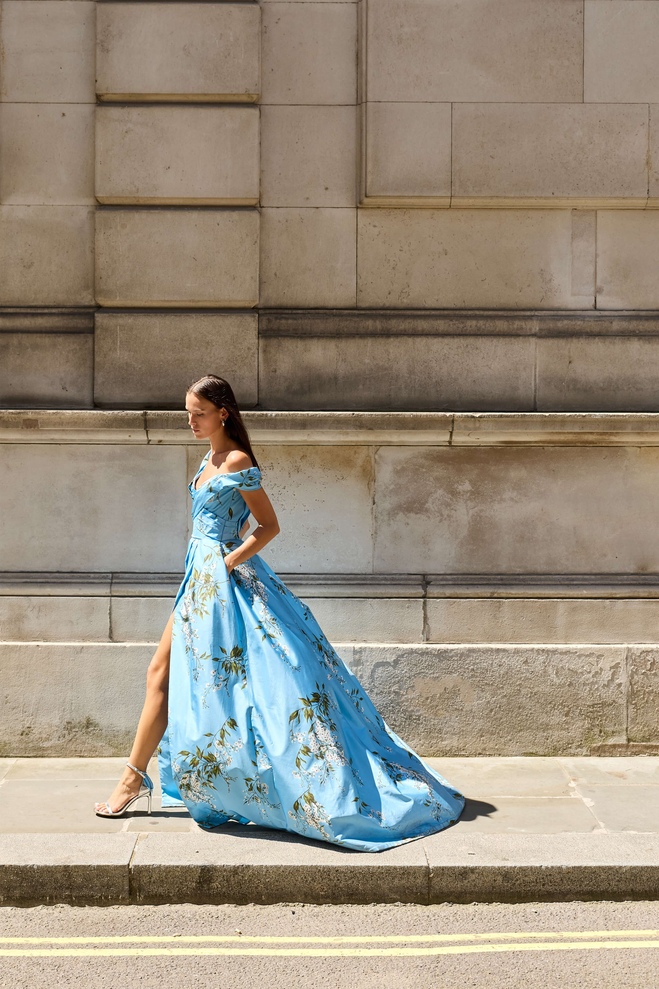 Monique Lhuillier Fall 2026 Blue wisteria printed taffeta asymmetric off-the-shoulder draped ballgown with slit- lookbook.