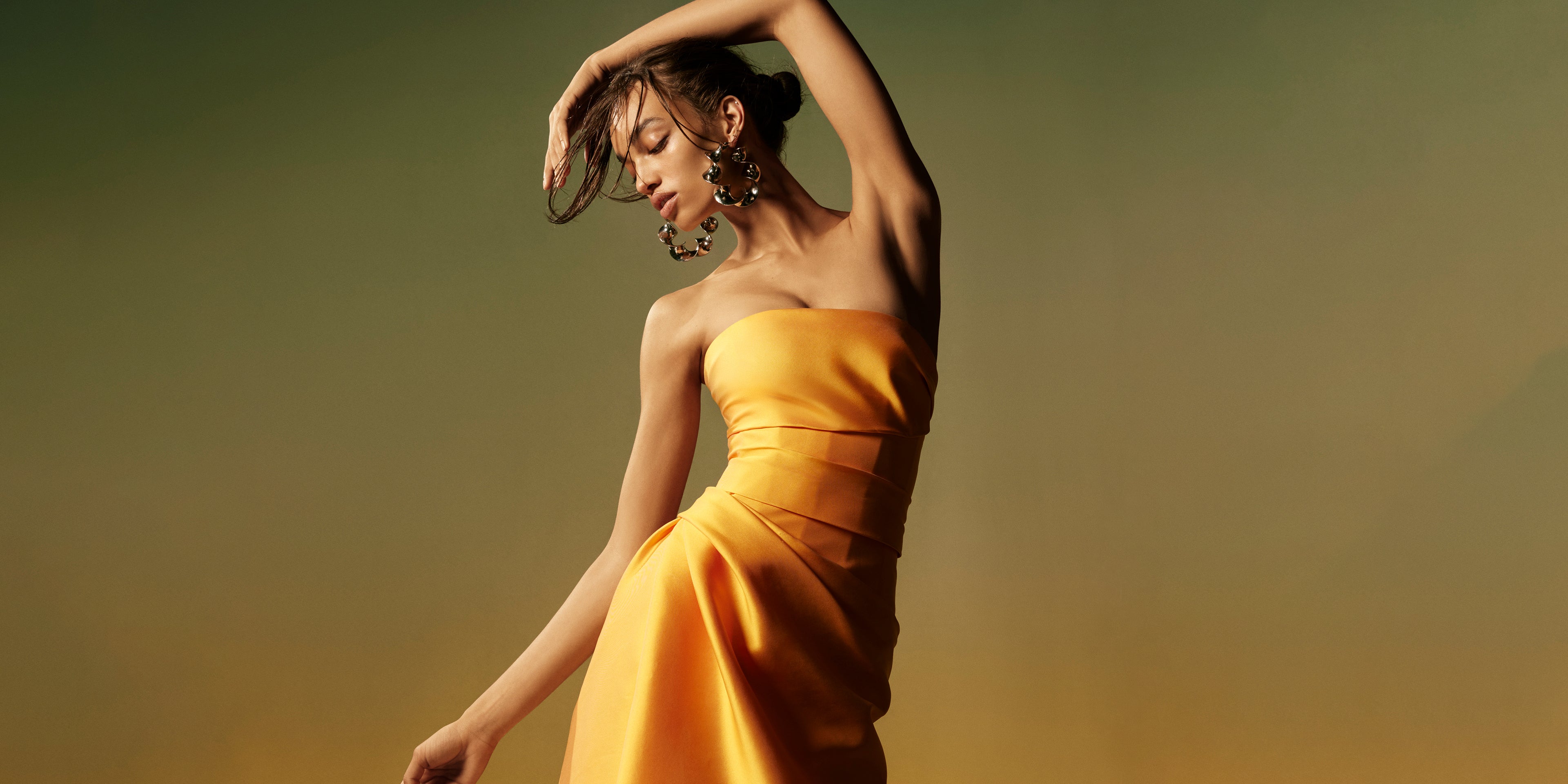 Monique Lhuillier Spring 2026  Mikado Mango strapless corseted draped gown with slit - lookbook.