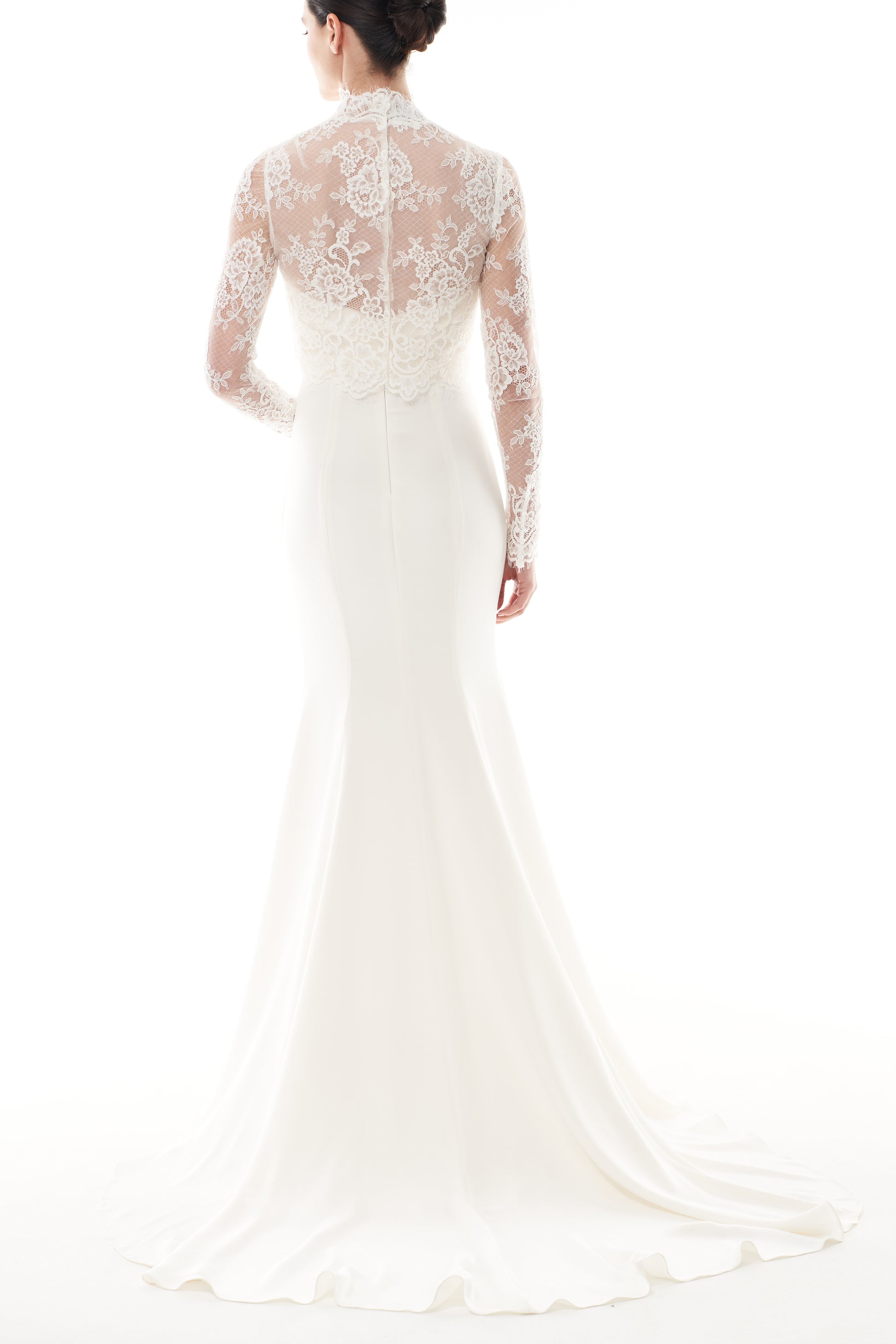Silk white, long sleeve lace bridal jacket with high neck and hook eye closure at the back.  Shown over silk white satin gown -back.