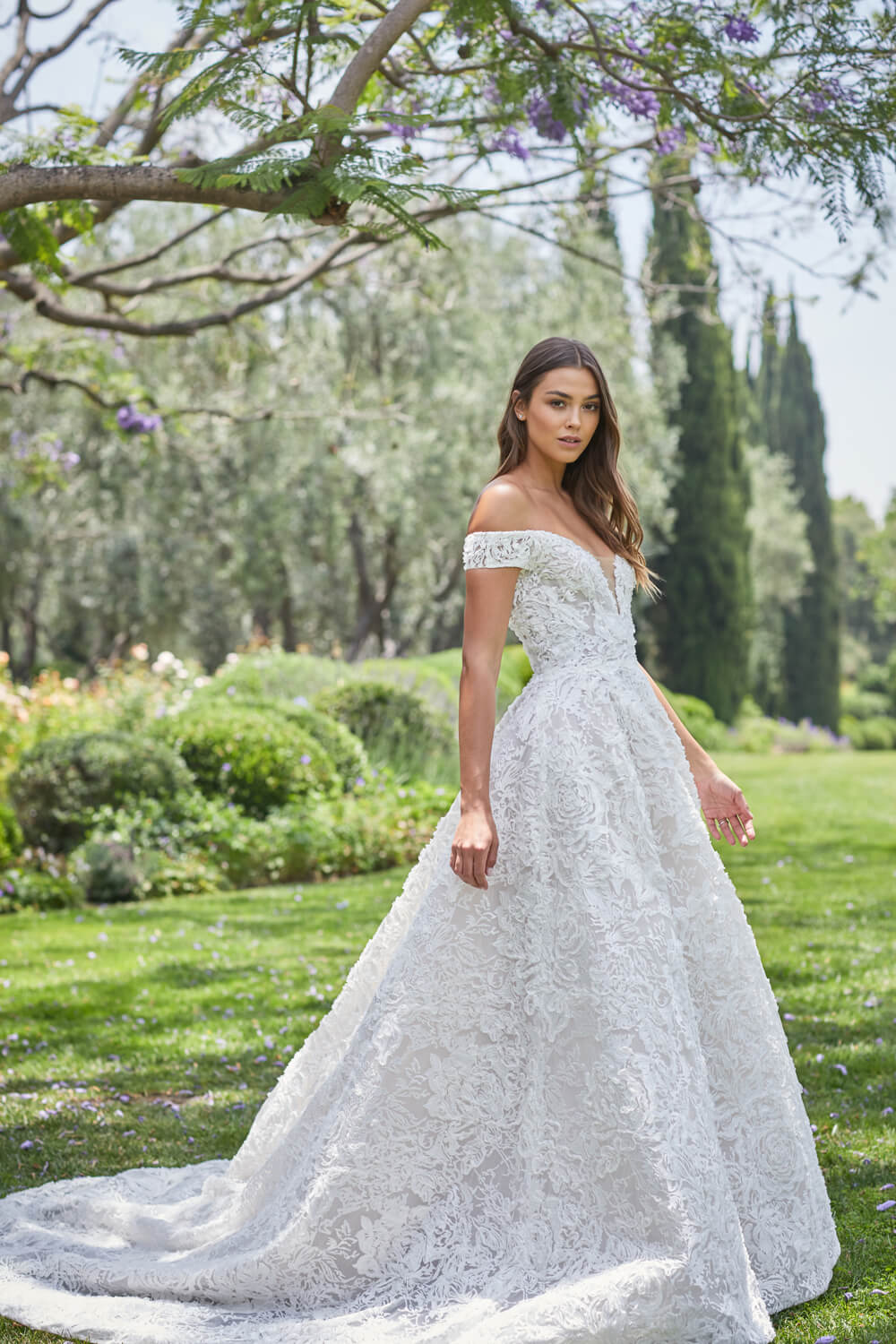 Woman wearing ivory lace off-the-shoulder a-line sweetheart Monique Lhuillier Spring 2021 Arabella ballgown