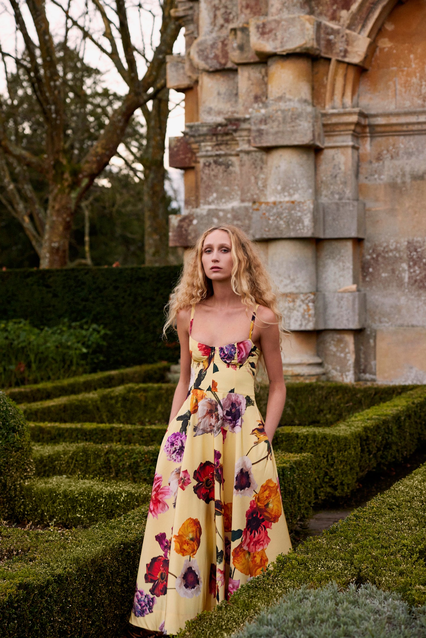 Monique Lhuillier Fall 2024 spaghetti strap, A-line cocktail dress with corseted bodice in yellow floral printed silk faille - lookbook.