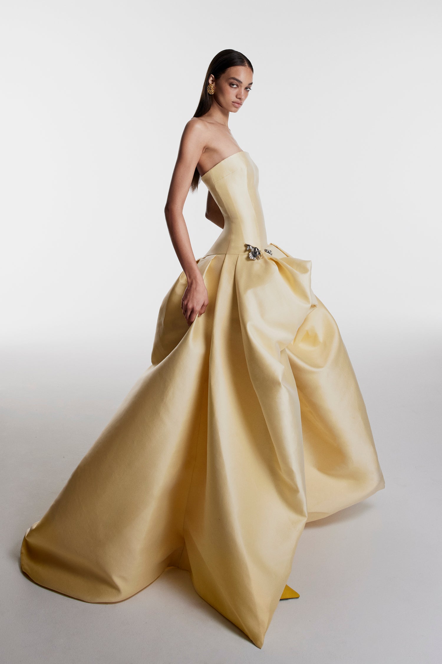Monique Lhuillier Fall 2026 Pale Yellow Mikado Pique strapless ballgown with train and floral embellishment - lookbook.