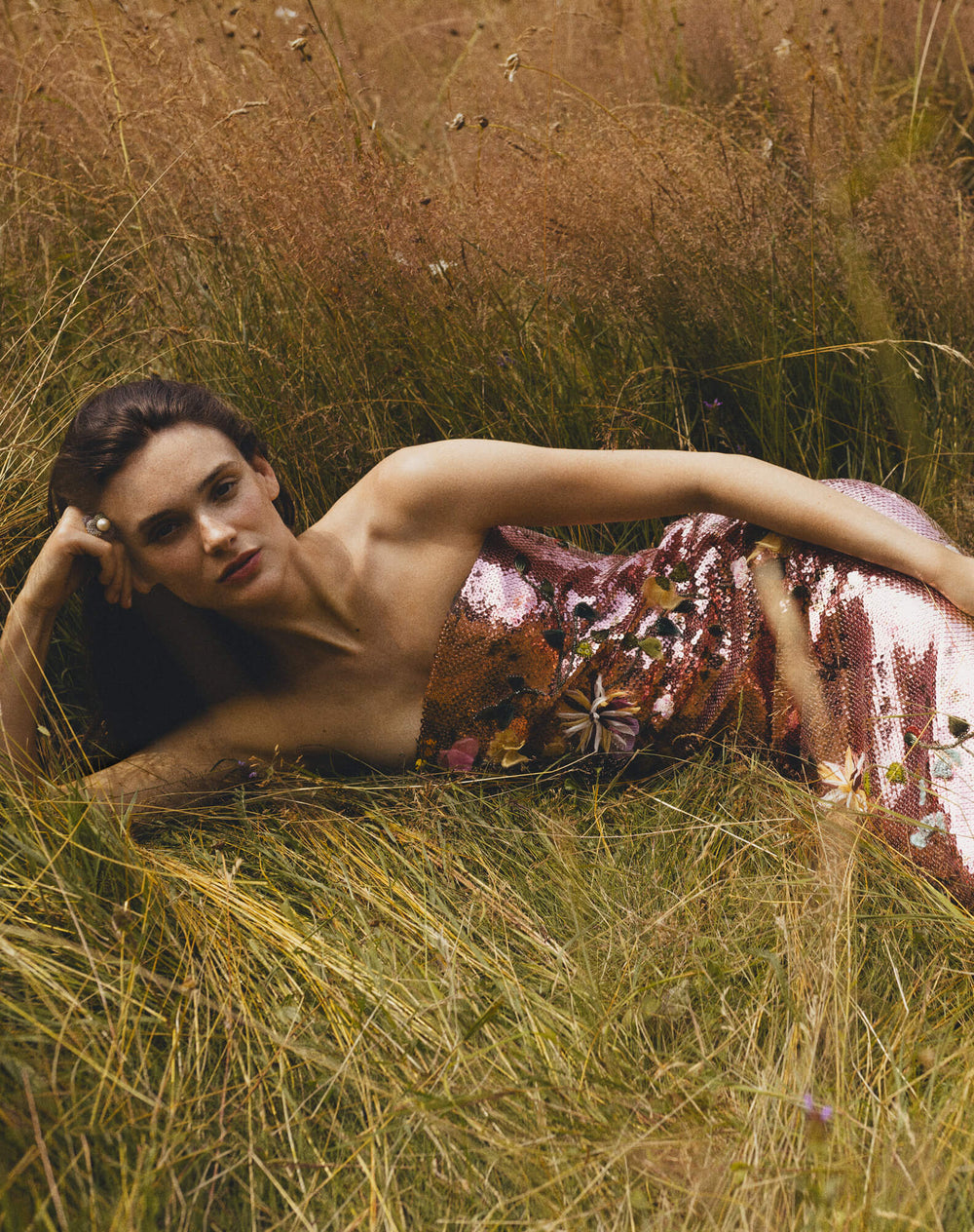 Monique Lhuillier Spring 2024 strapless column gown in cerise colored sequins and floral embroidery.