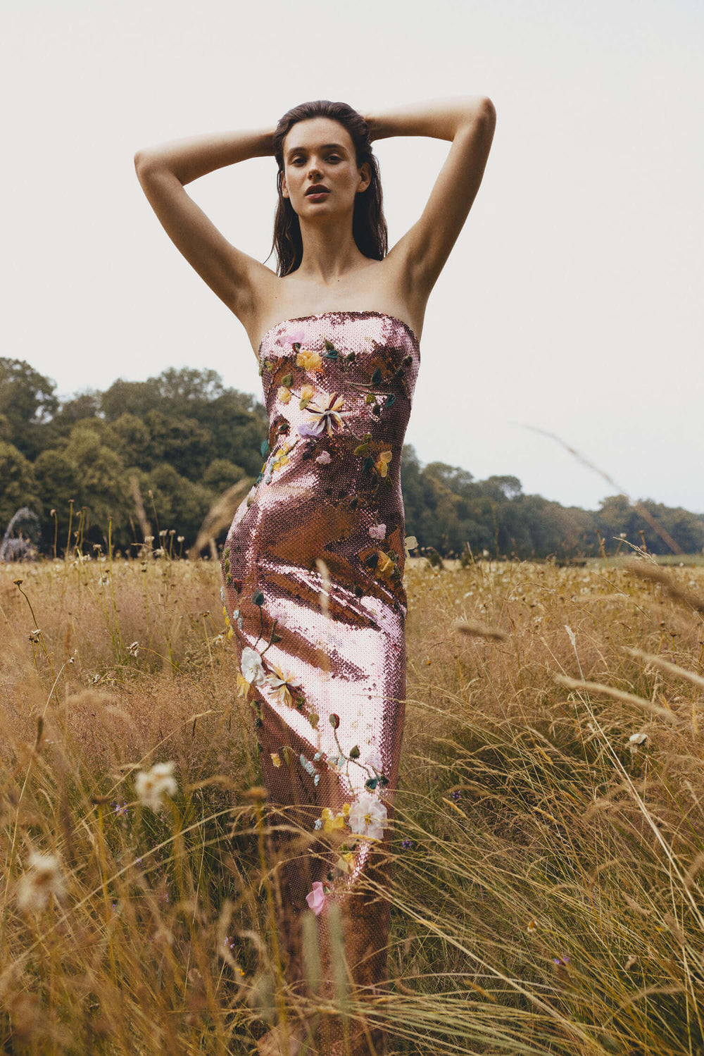 Monique Lhuillier Spring 2024 strapless column gown in cerise colored sequins and floral embroidery.