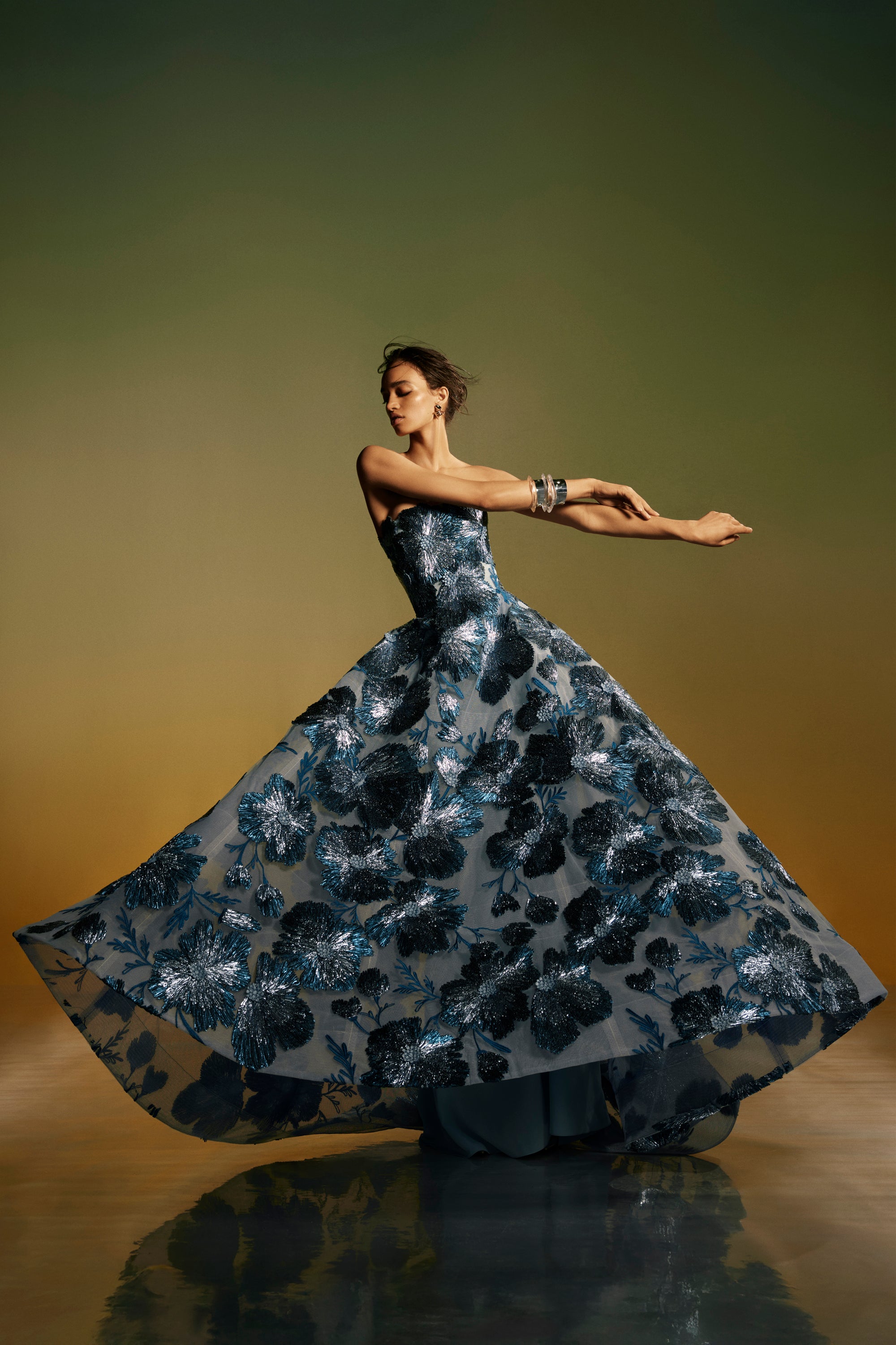 Monique Lhuillier Spring 2026 lookbook image - model wearing Lake/Multi Raffia Floral Embroidered Tulle strapless ballgown