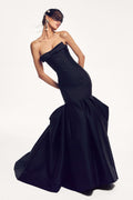 Monique Lhuillier Spring 2027 Noir Mikado strapless exaggerated trumpet gown with bow at neckline - lookbook.