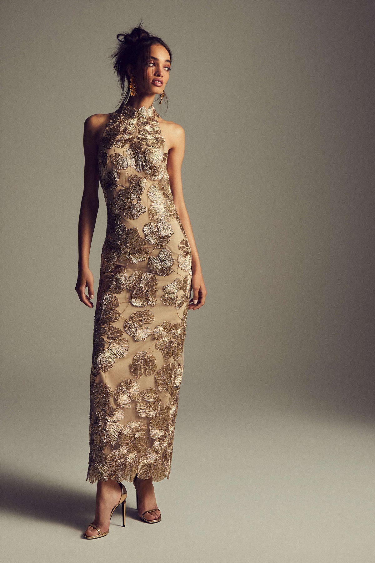 Monique Lhuillier Spring 2027 light gold embroidered tulle floral halter column gown - lookbook.