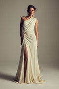 Monique Lhuillier Spring 2027 Ivory Crepe Jersey one-shoulder draped gown with slit and gold piercing at hip - lookbook.