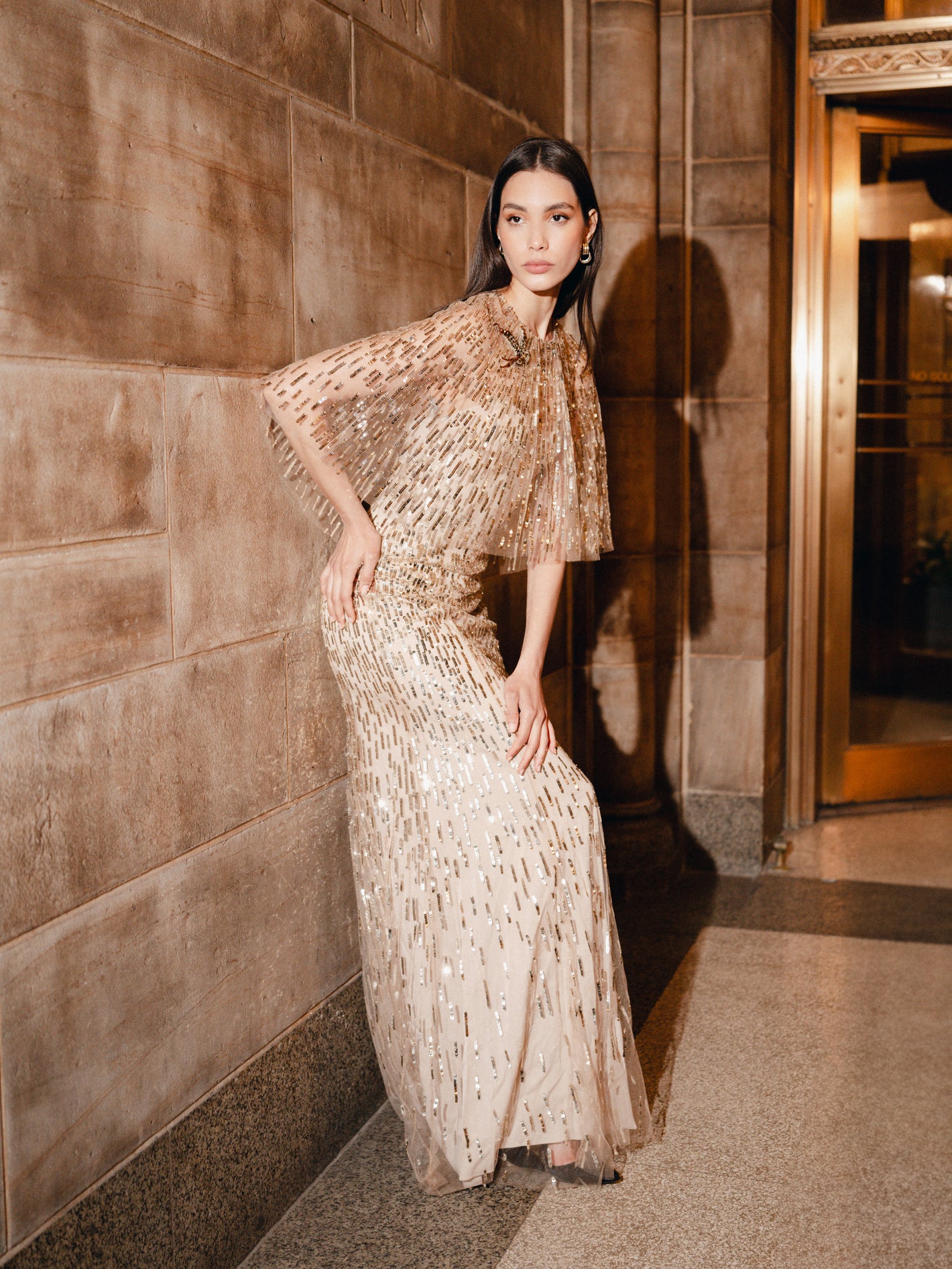 Monique Lhuillier Fall 2025 Gold Tulle Embroidered A-line gown with integral
capelet - lookbook photo 