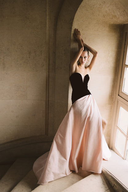 Monique Lhuillier pale blush and noir strapless ballgown with sweetheart neckline, drop waist and high slit in skirt.  