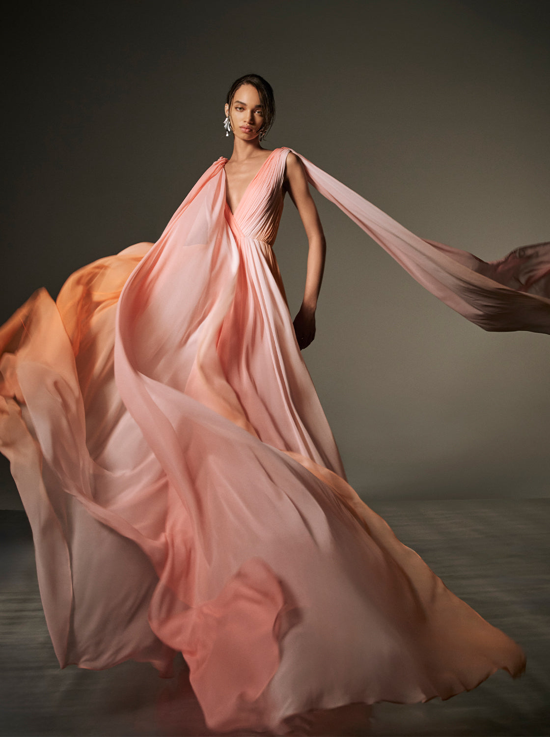 Monique Lhuillier Spring 2026 Plumeria ombre chiffon pleated v-neck gown with streamers - lookbook.