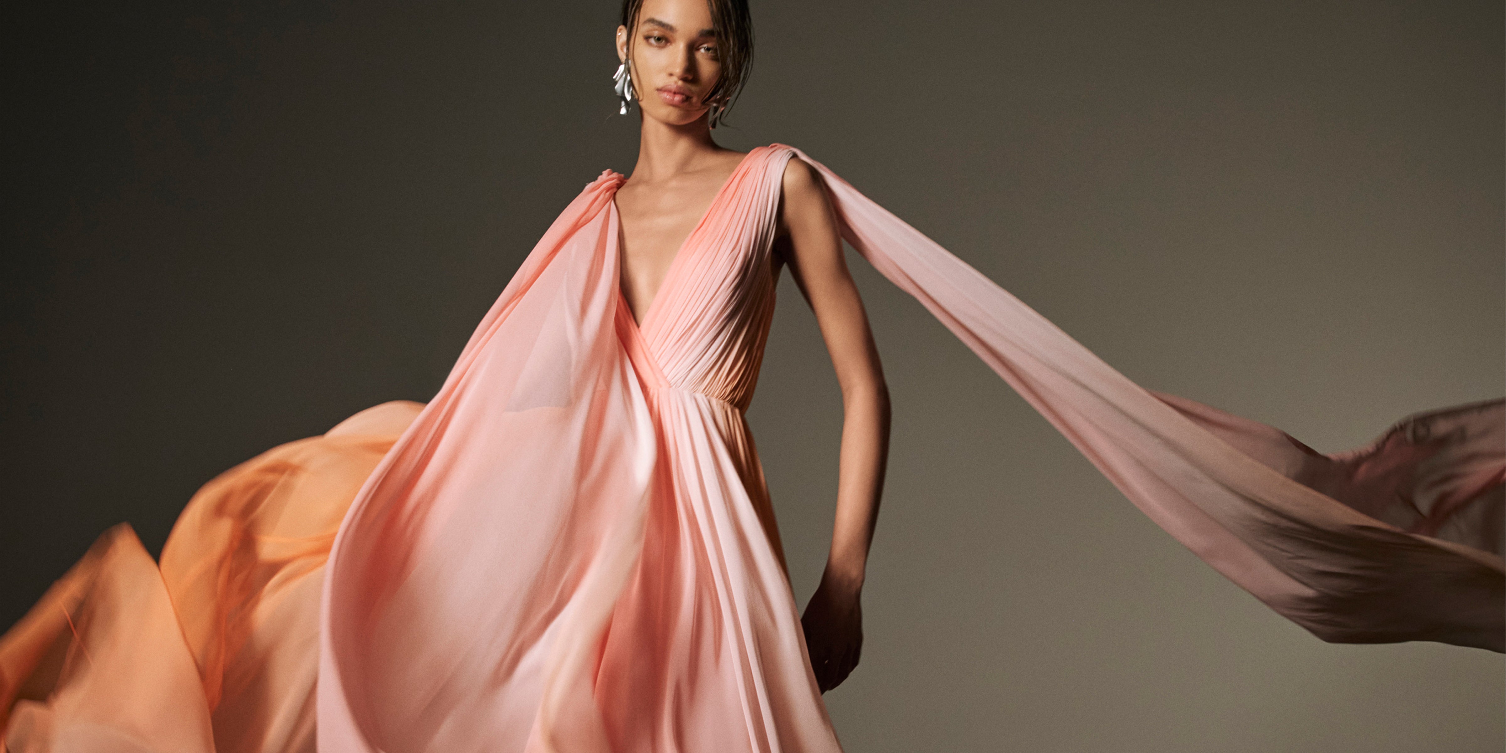 Monique Lhuillier Spring 2026 Plumeria ombre chiffon pleated v-neck gown with streamers - lookbook.